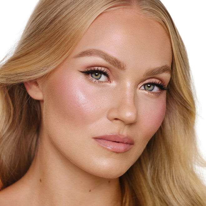 a woman with hydrating skincare products on her face