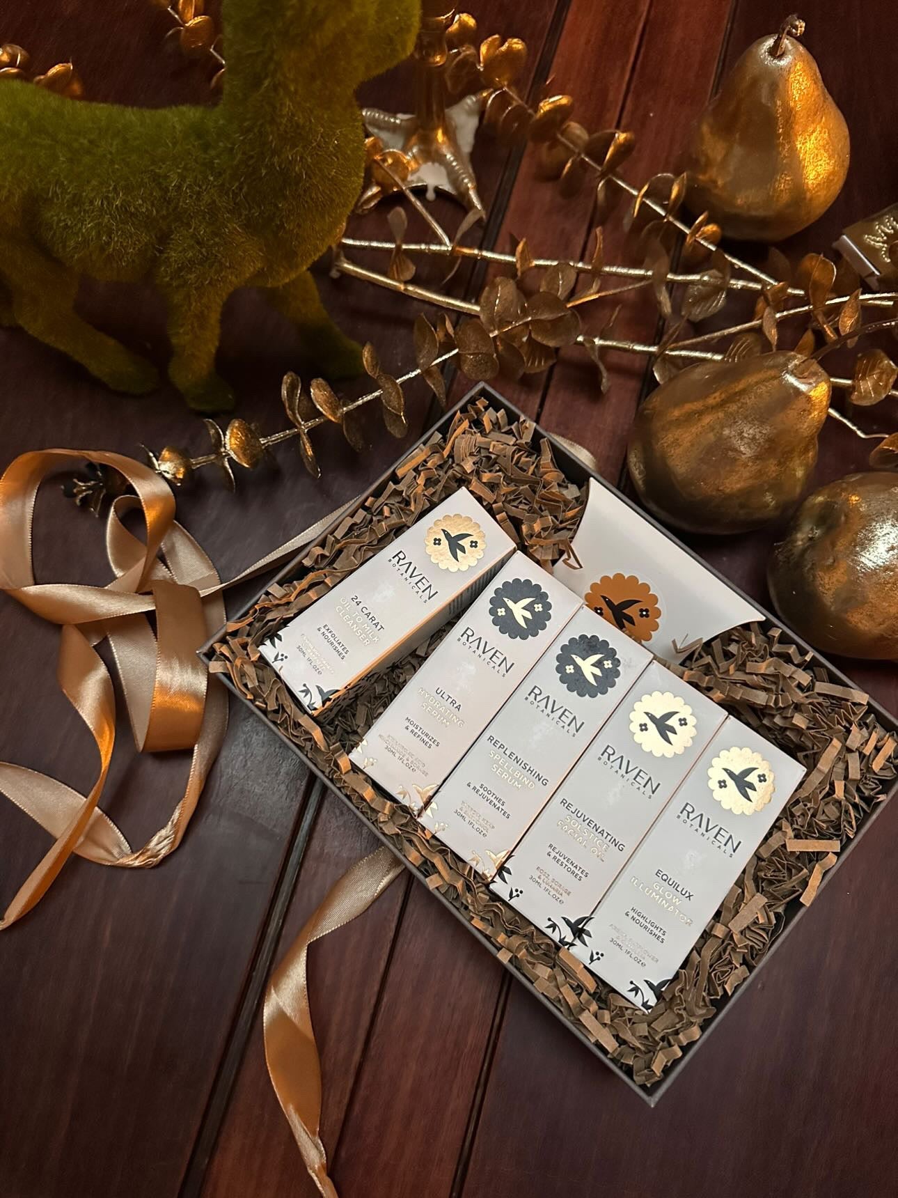 Raven Botanicals luxury Scottish Gift Set on a wooden surface with decorative elements