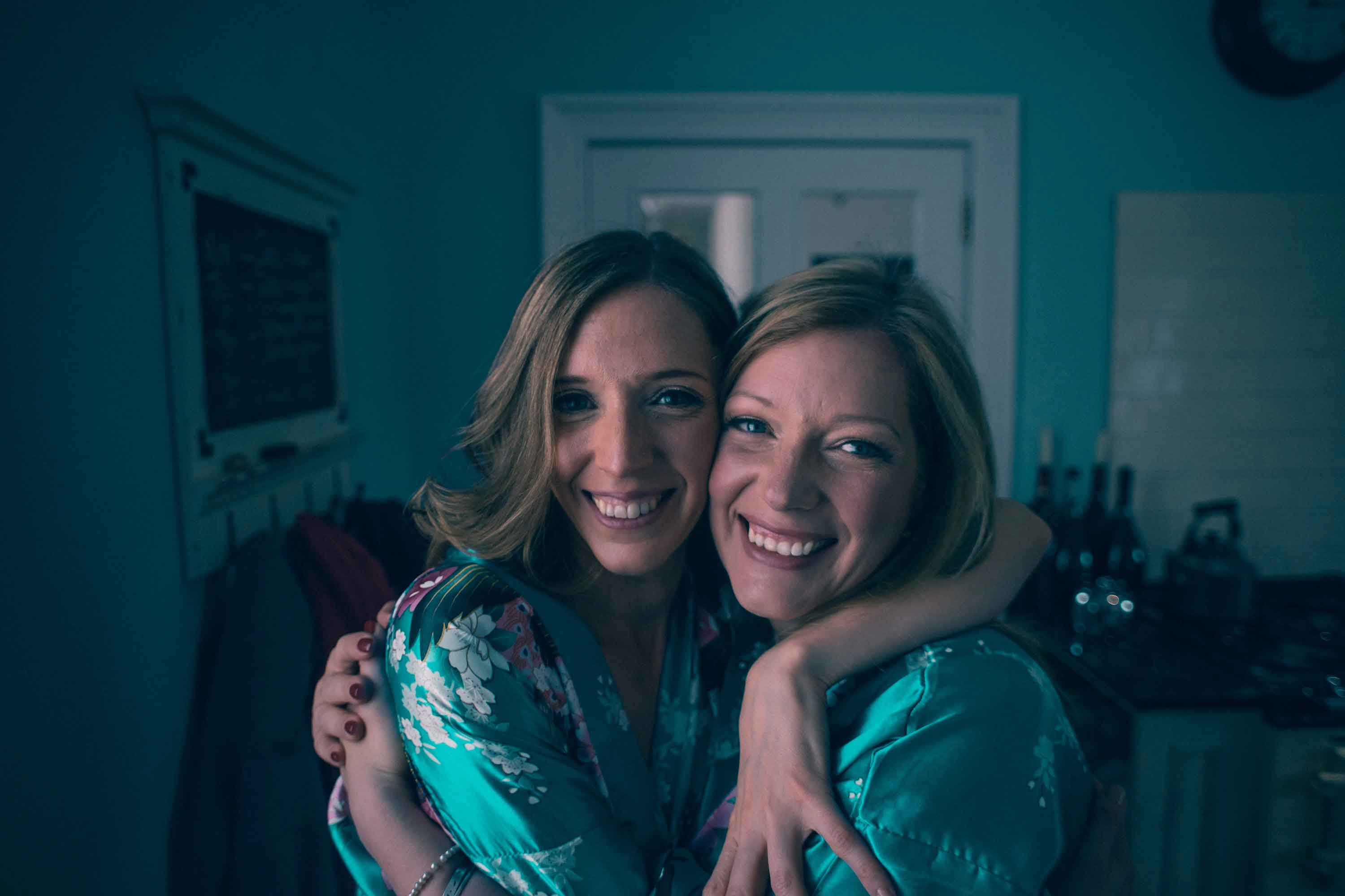 Arabella and Charlotte, founders of Raven Botanicals, embracing
